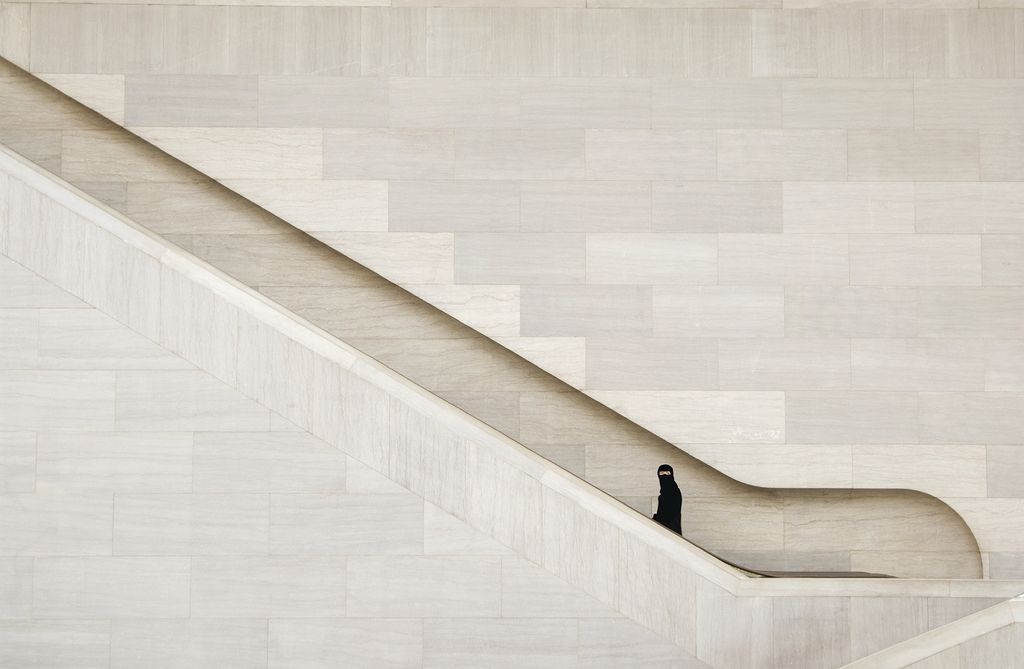 Muslim Woman Ascending Stairs