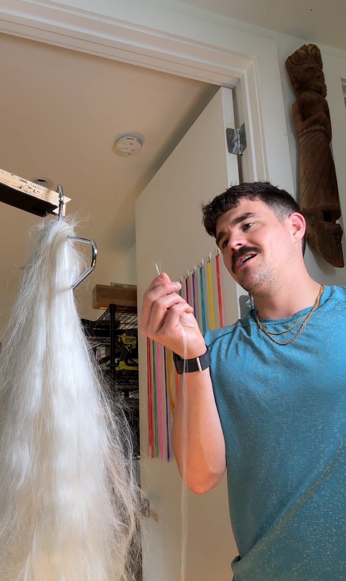 Screenshot I get the silk harvested from silkworm cocoons. It comes in a large loop, unraveled from silkworm cocoons, called a hank. From here, I pull the strands into smaller bundles of approximately 200 strands of silk. This process is done only pulling a 1-5 strands of silk at a time, Because the silk is still somewhat sticky from the protein seracin that holds the cocoon together, I can't pull out too much at once as it ends up knotting on itself and ruining the hank of silk over time